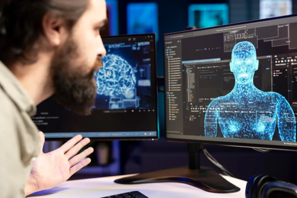 um jovem analisando seu programa de IA em duas telas no laboratório.