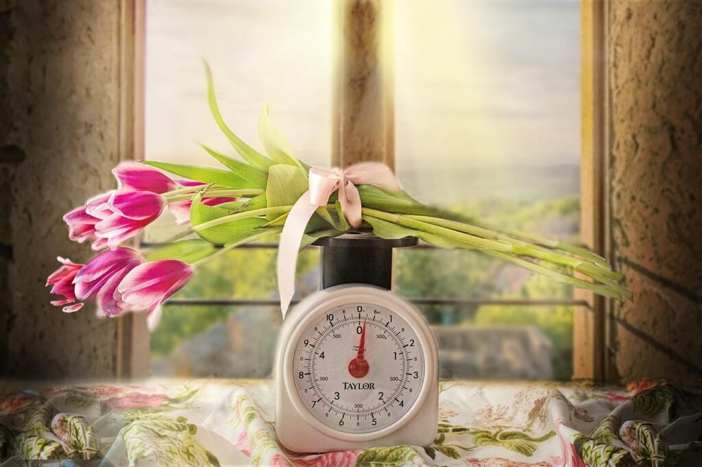 buquê de flores numa balança.